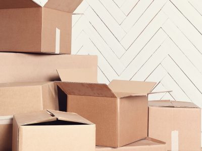 Moving home. Cardboard boxes on the floor