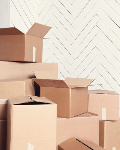 Moving home. Cardboard boxes on the floor